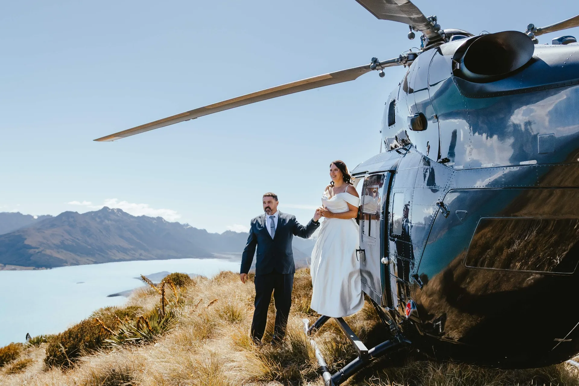 Bride and groom arriving by helicopter at Mt Crichton, Queenstown